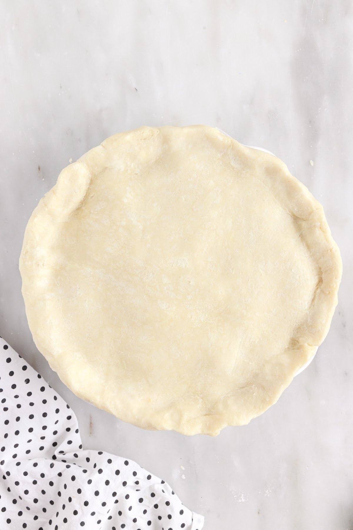 Pinch the top pie crust to the bottom pie crust.