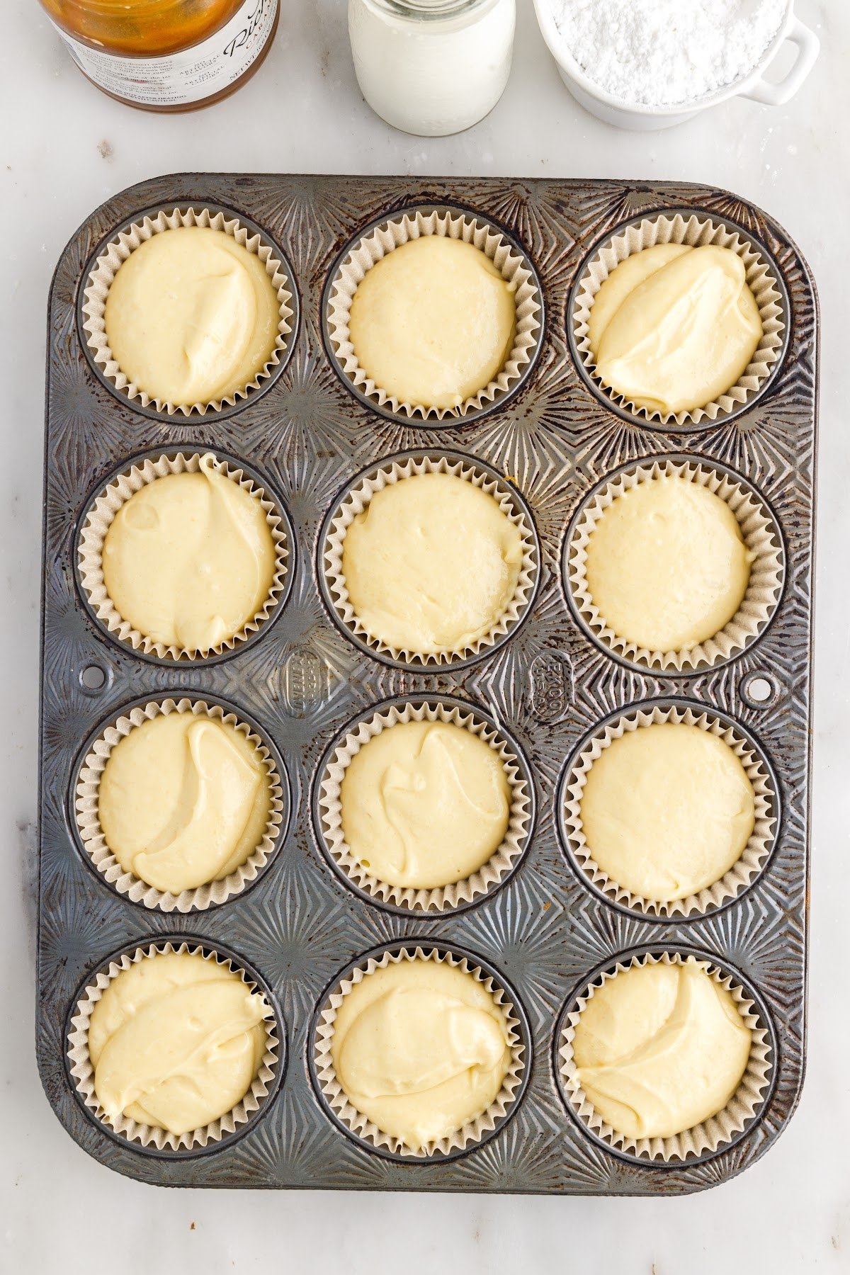 Poured cake batter into the cupcake liners.