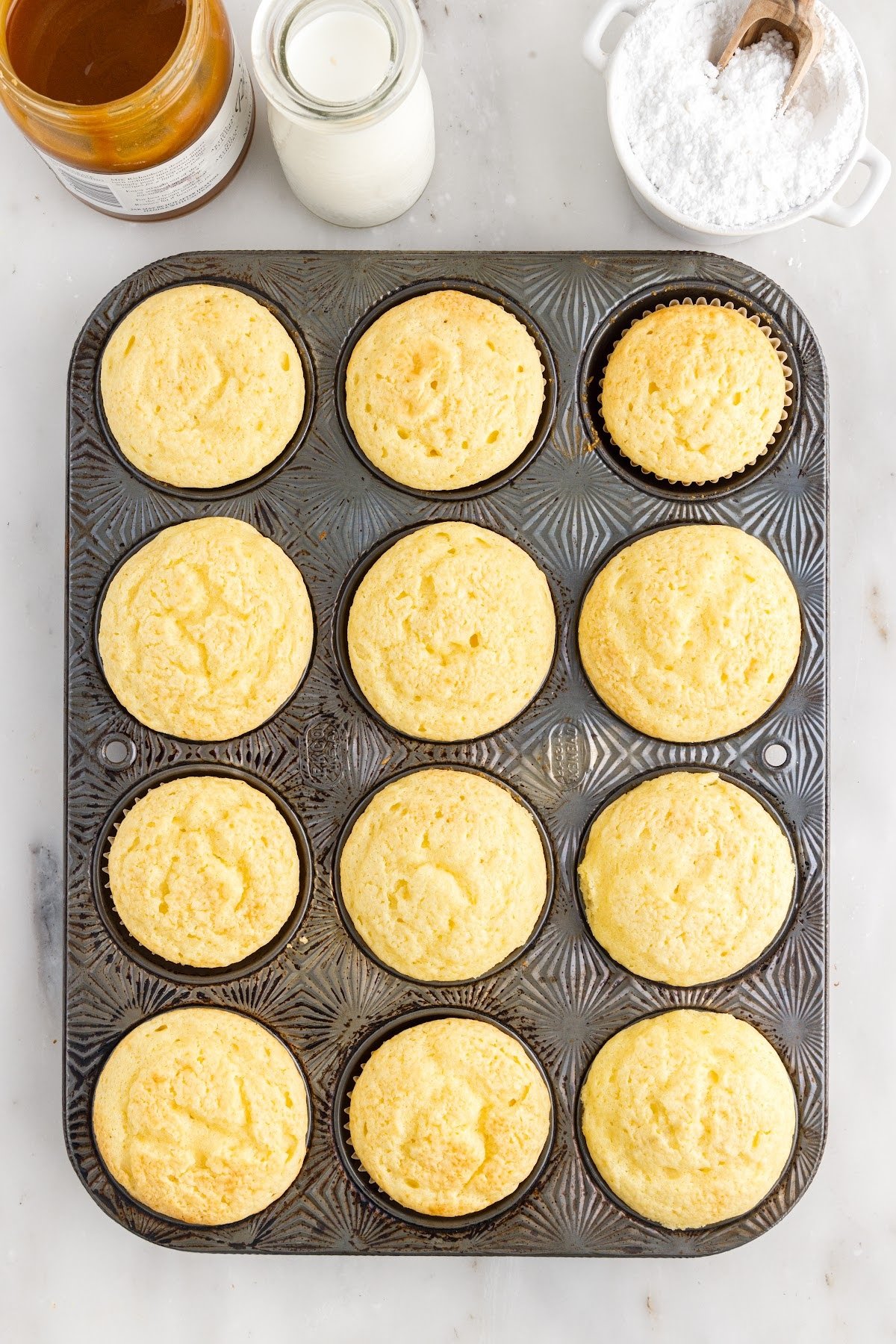 Fully baked cupcakes.