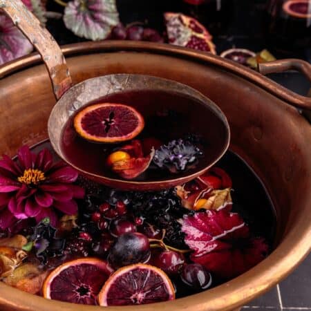 Scooping out Halloween sangria.