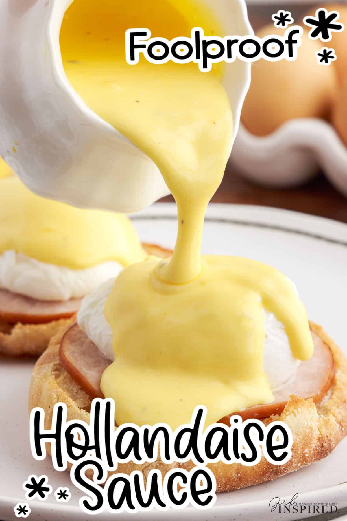 Pouring hollandaise sauce that was made in a food processor over eggs benedict.