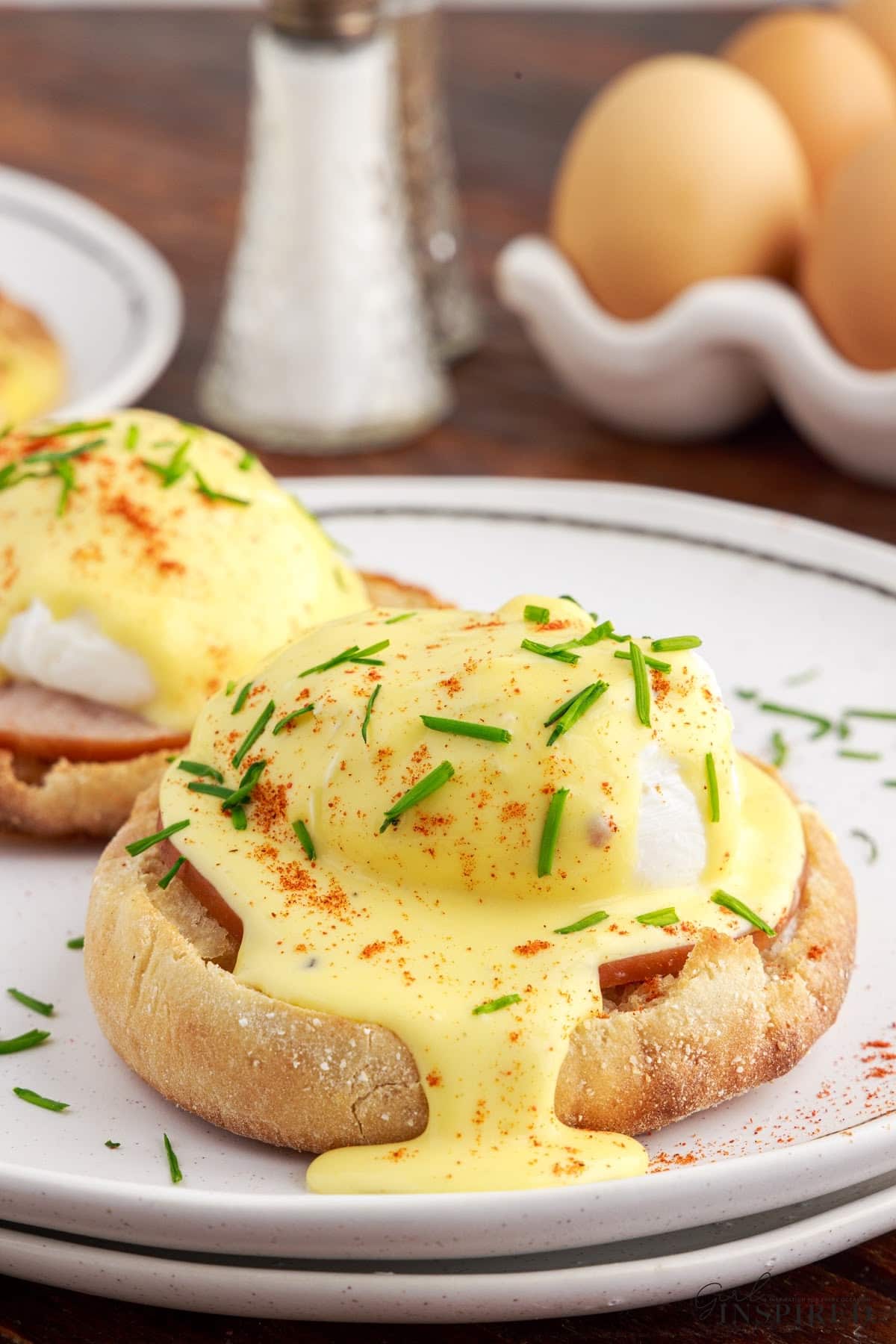 Eggs Benedict topped with foolproof hollandaise sauce made in a food processor.