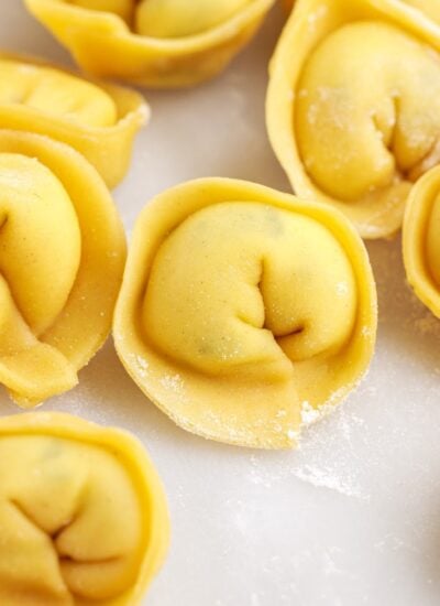 Homemade Tortellini laying on the counter.