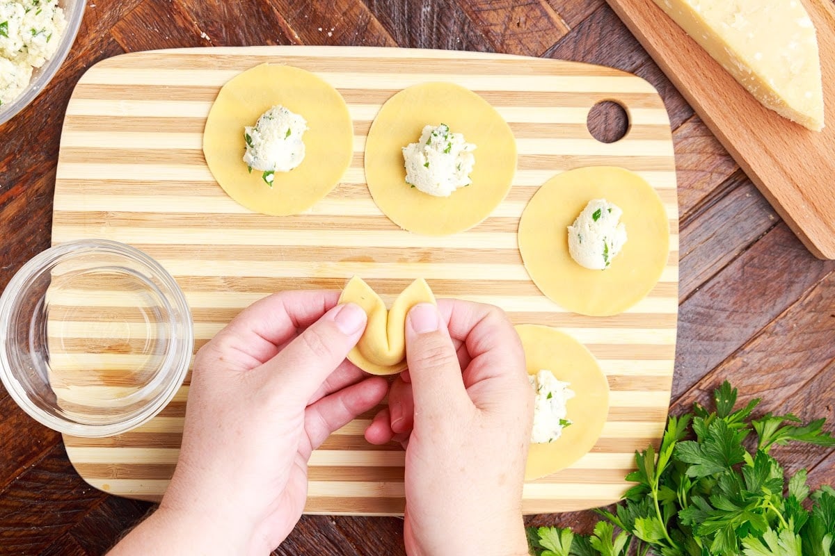 Folding the tortellini.