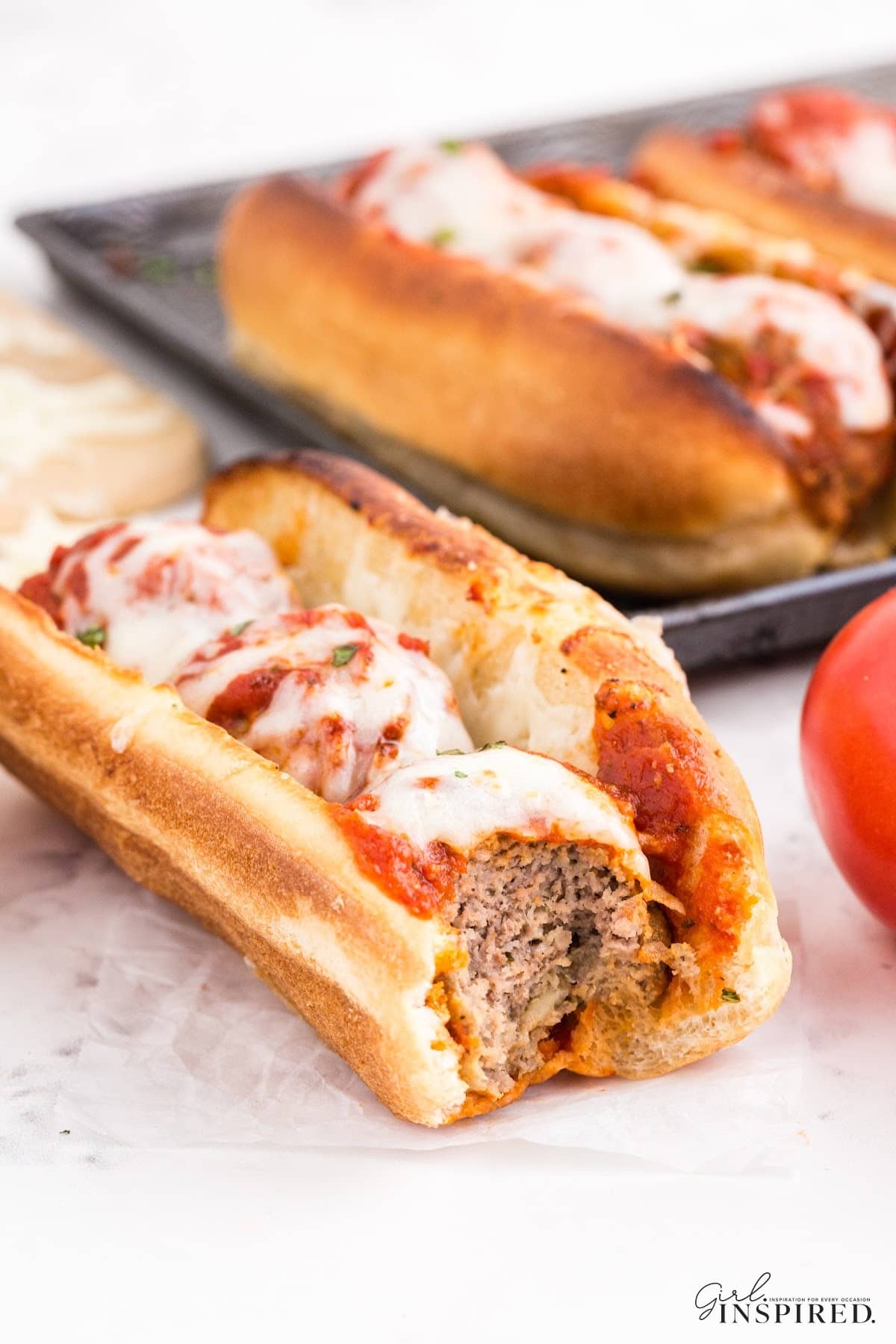 Meatball Marinara Sub openface, showing the meatballs and cheese inside.