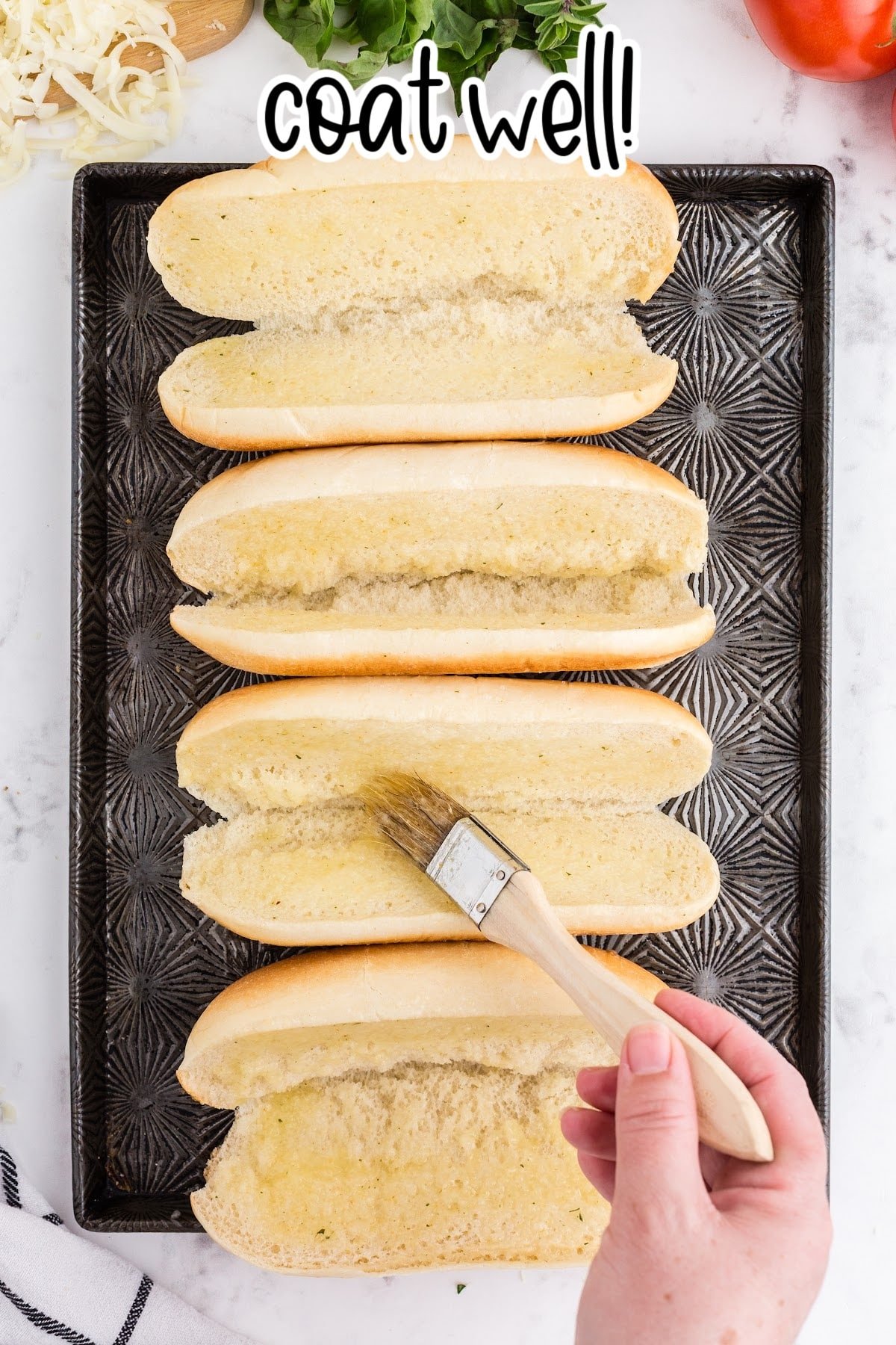 Rubbing the butter on the sliced breads.