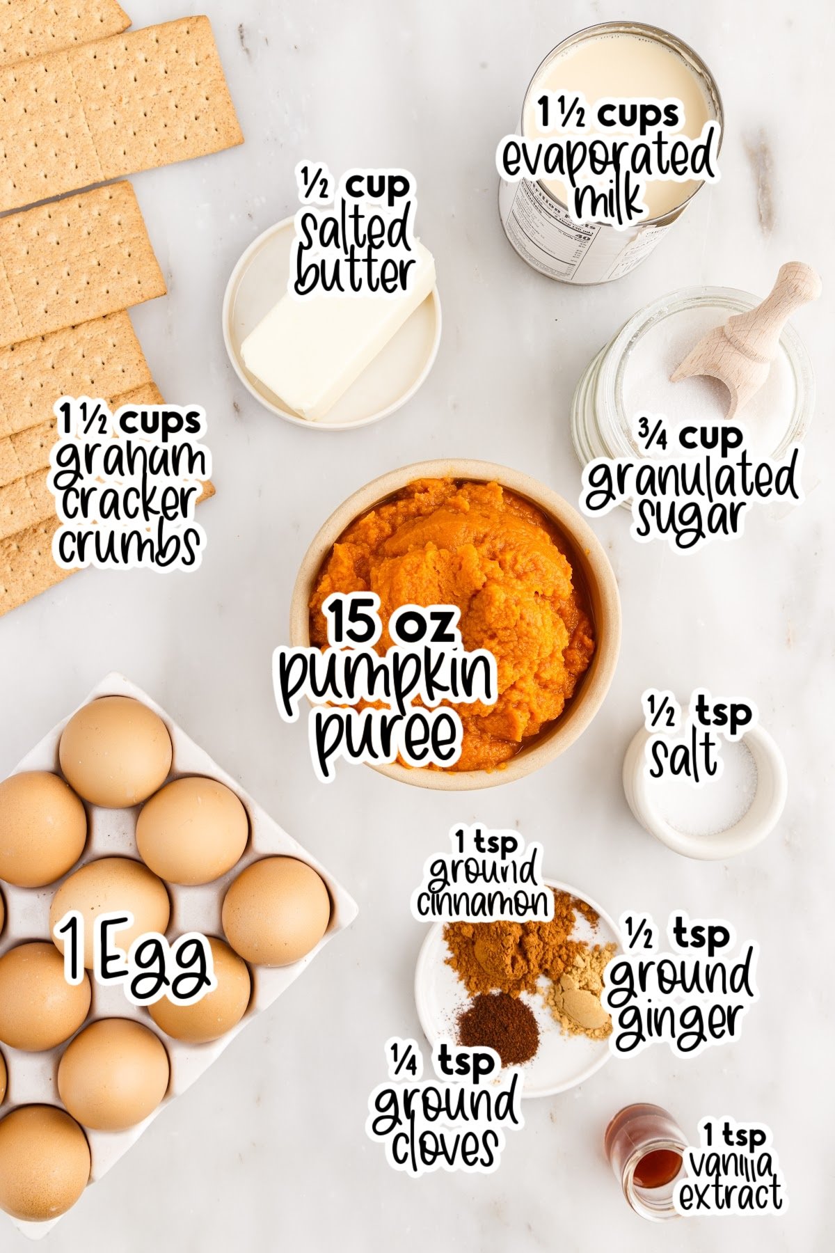 Ingredients needed to make a pumpkin pie with graham cracker crust.