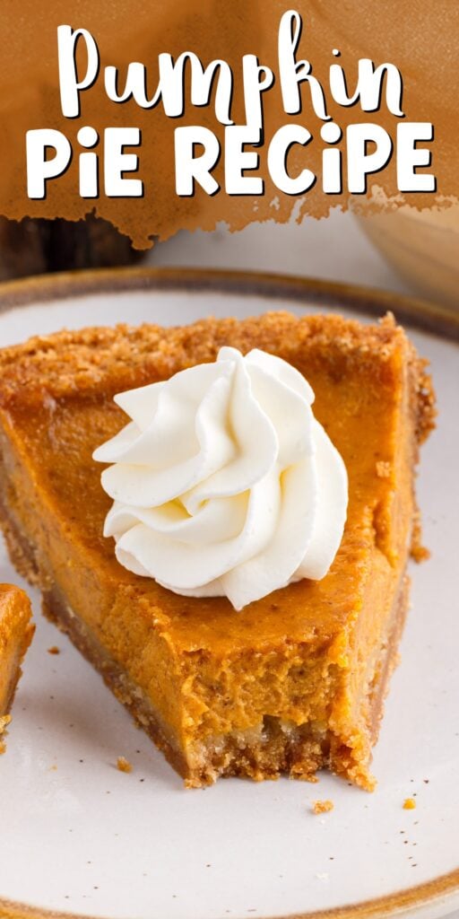 A slice of pumpkin pie with whip cream on top.