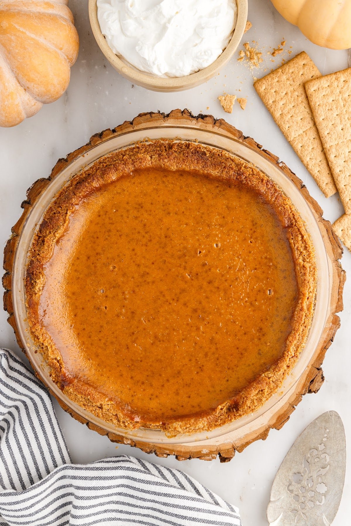 The finished baked pumpkin pie with graham cracker crust.