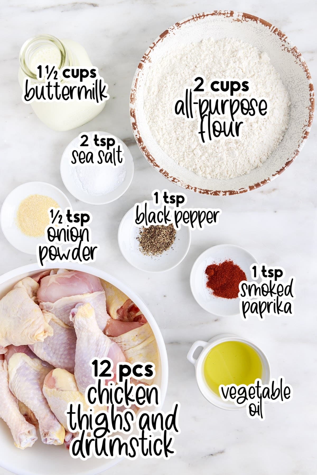 All ingredients on the counter to make this Southern Fried Chicken, in small bowls with text overlays.