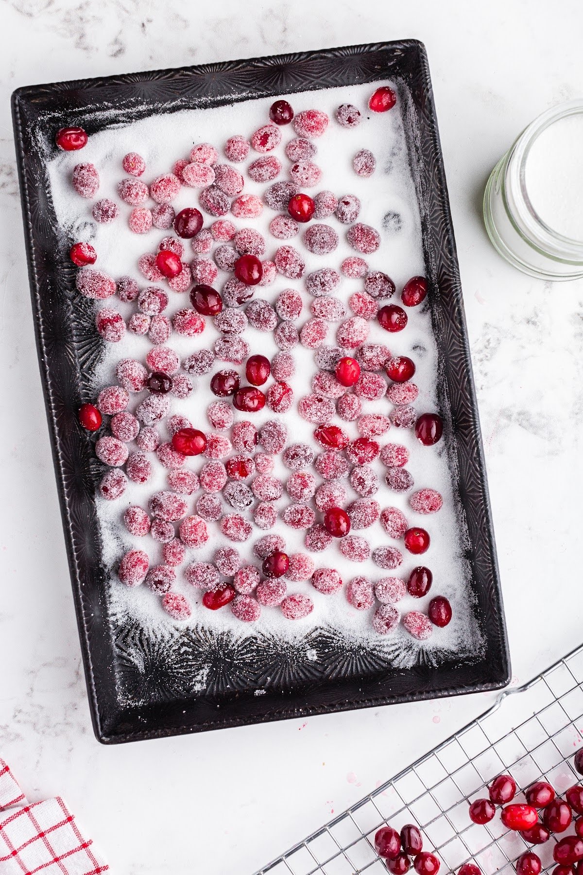 Tossed cranberries in the sugar.