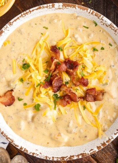 Bowl of Bacon Cheeseburger Soup with toppings.