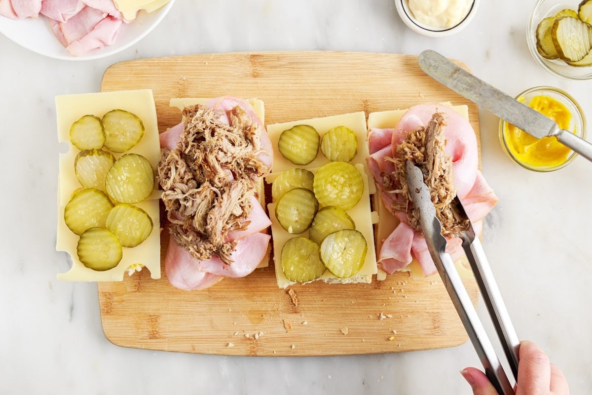 Adding the pickles and roast meat.