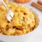 Bowl of Pumpkin Mac and Cheese, with a fork in the bowl.