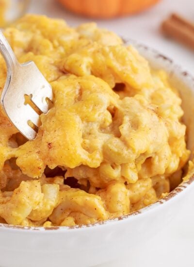 Bowl of Pumpkin Mac and Cheese, with a fork in the bowl.