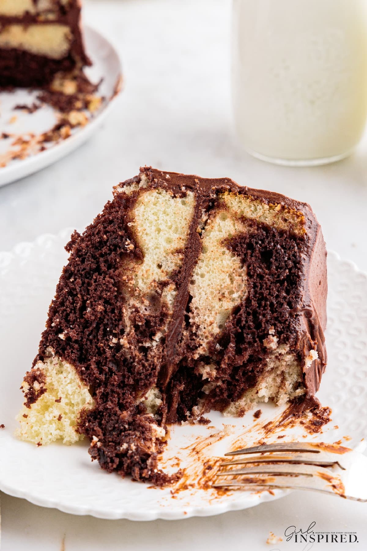 Slice of Marble Cake showing the insides on a plate.