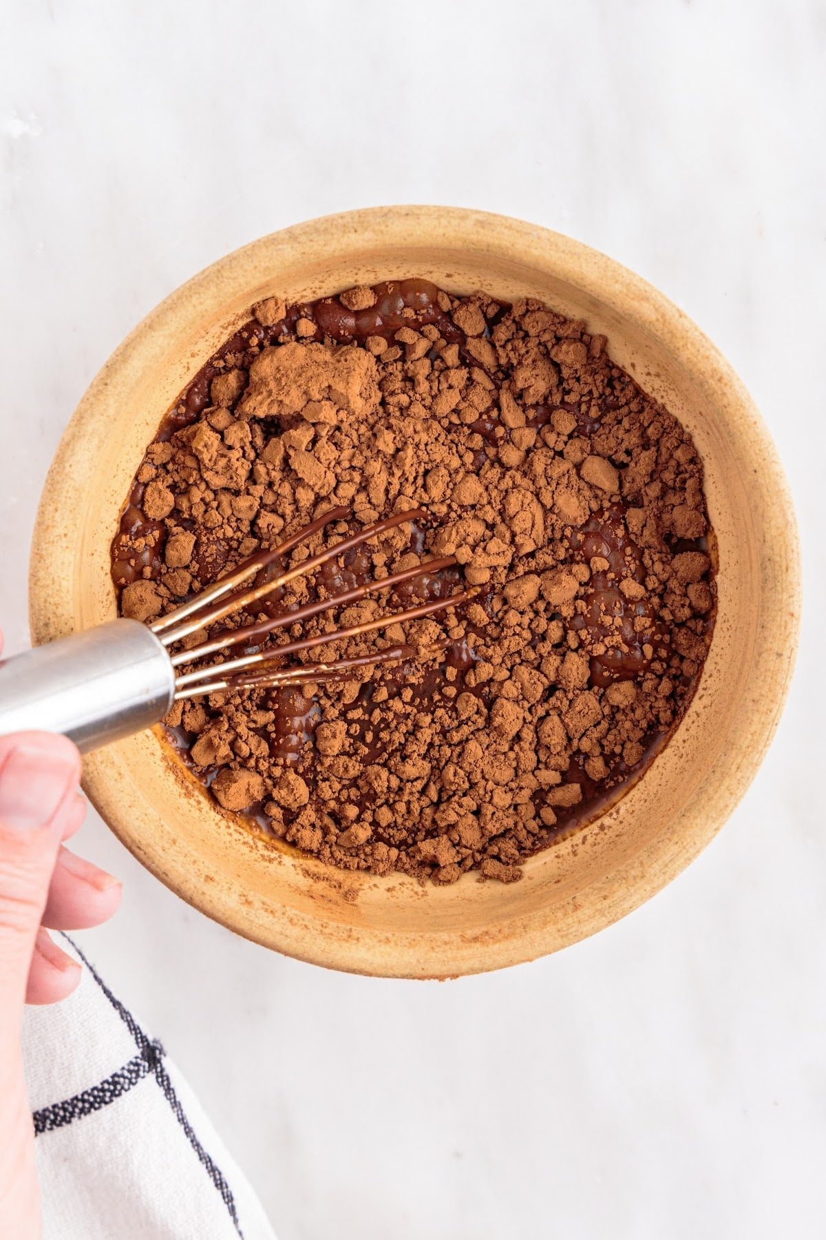 Adding in the other ingredients in the melted chocolate.