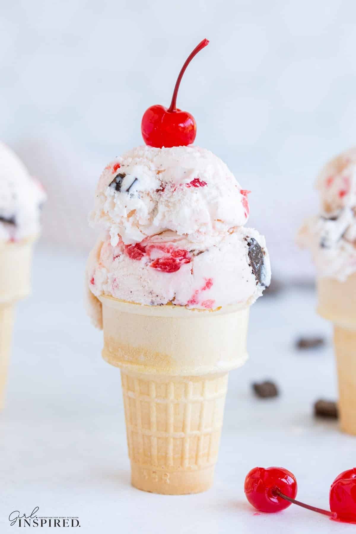 A cone of homemade cherry garcia ice cream.
