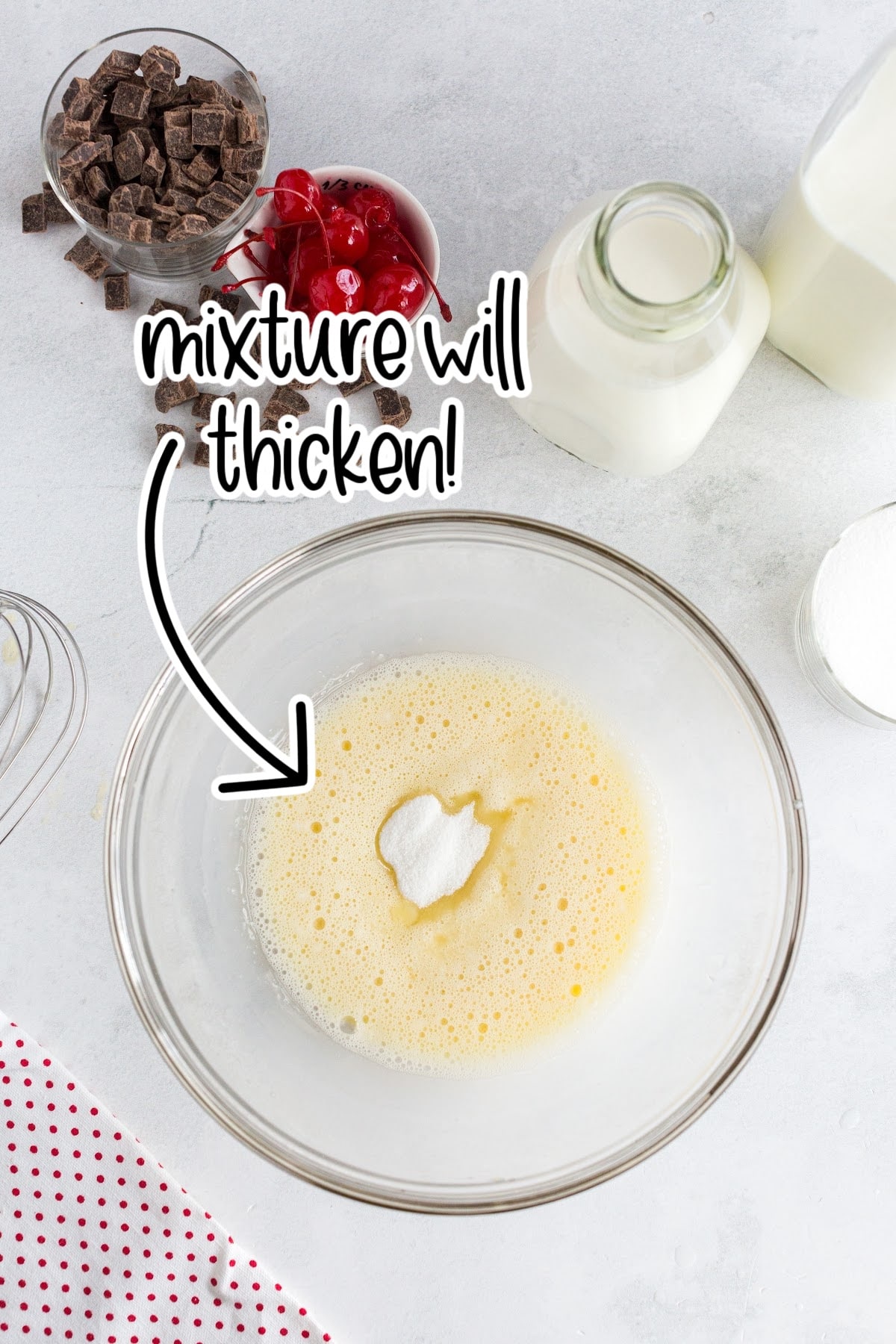 Frothy whisked eggs with sugar added.