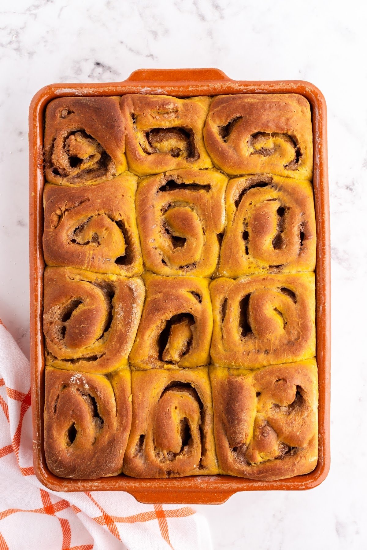 Fully baked rolls in the baking dish.