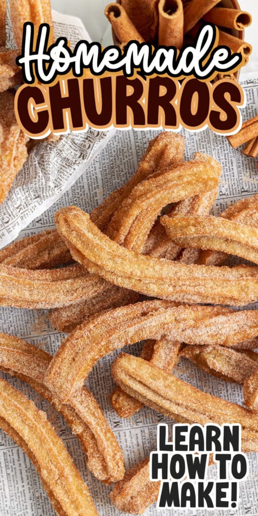 Many Churros on the counter, covered in cinnamon/sugar mixture, with a bowl filled with Churros on the side, and text overlay.