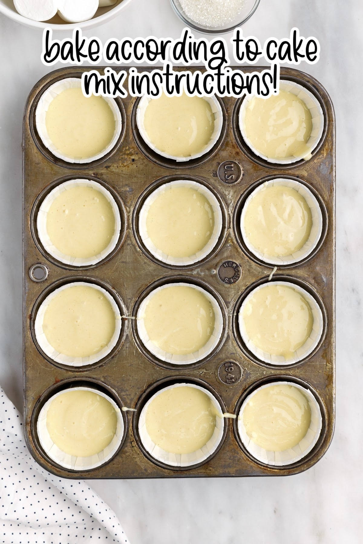 Filling the cupcake tins with the cake batter, with text overlay.