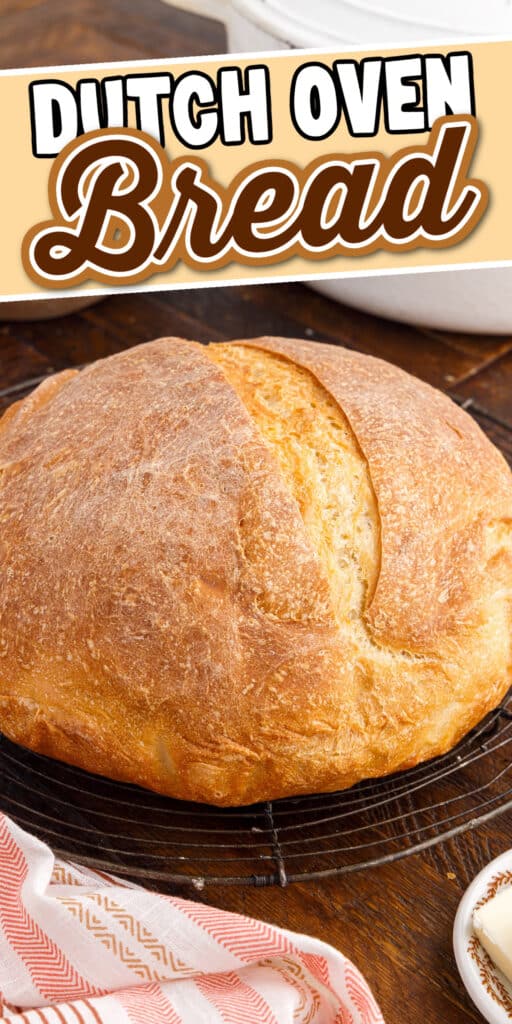 Loaf of Dutch Oven Bread on the wood cutting board, with ingredients in the background and text overlay.