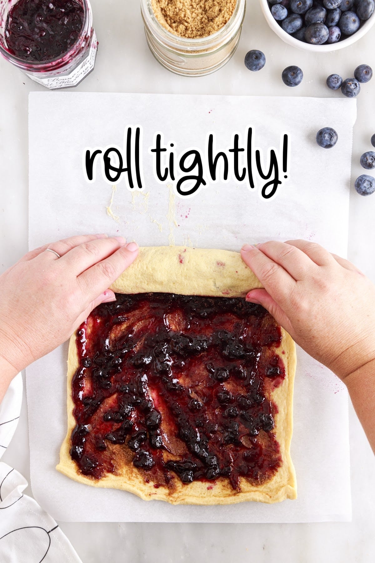 Rolling the dough into a circular log shape, with other ingredients in the background and text overlay.