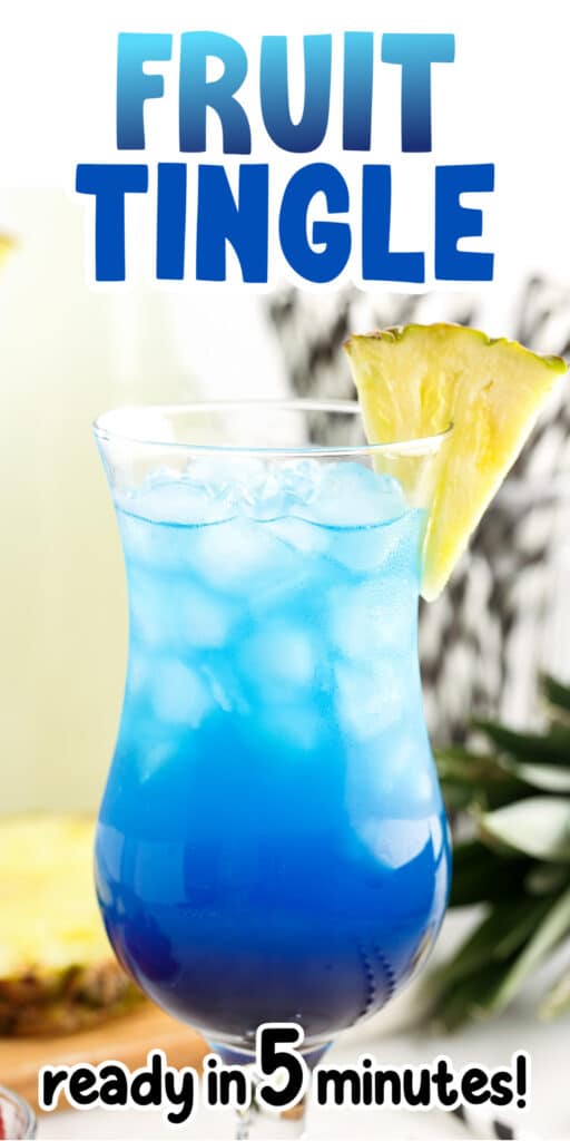 Fruit tingle cocktail in stemmed glass with two black and white striped straws and a pineapple wedge garnish, with text overlay.