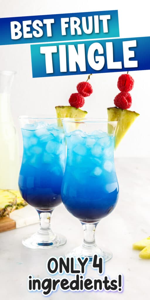 Two Fruit tingle cocktails in stemmed glass with two black and white striped straws and a pineapple wedge garnish.