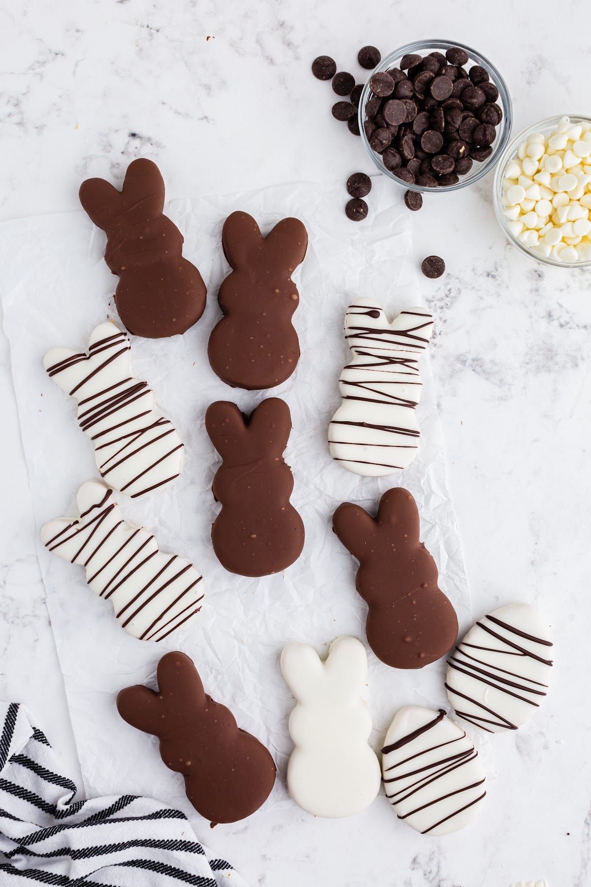 Finished bunnies on the counter covered in chocolate and drizzled in chocolate too.