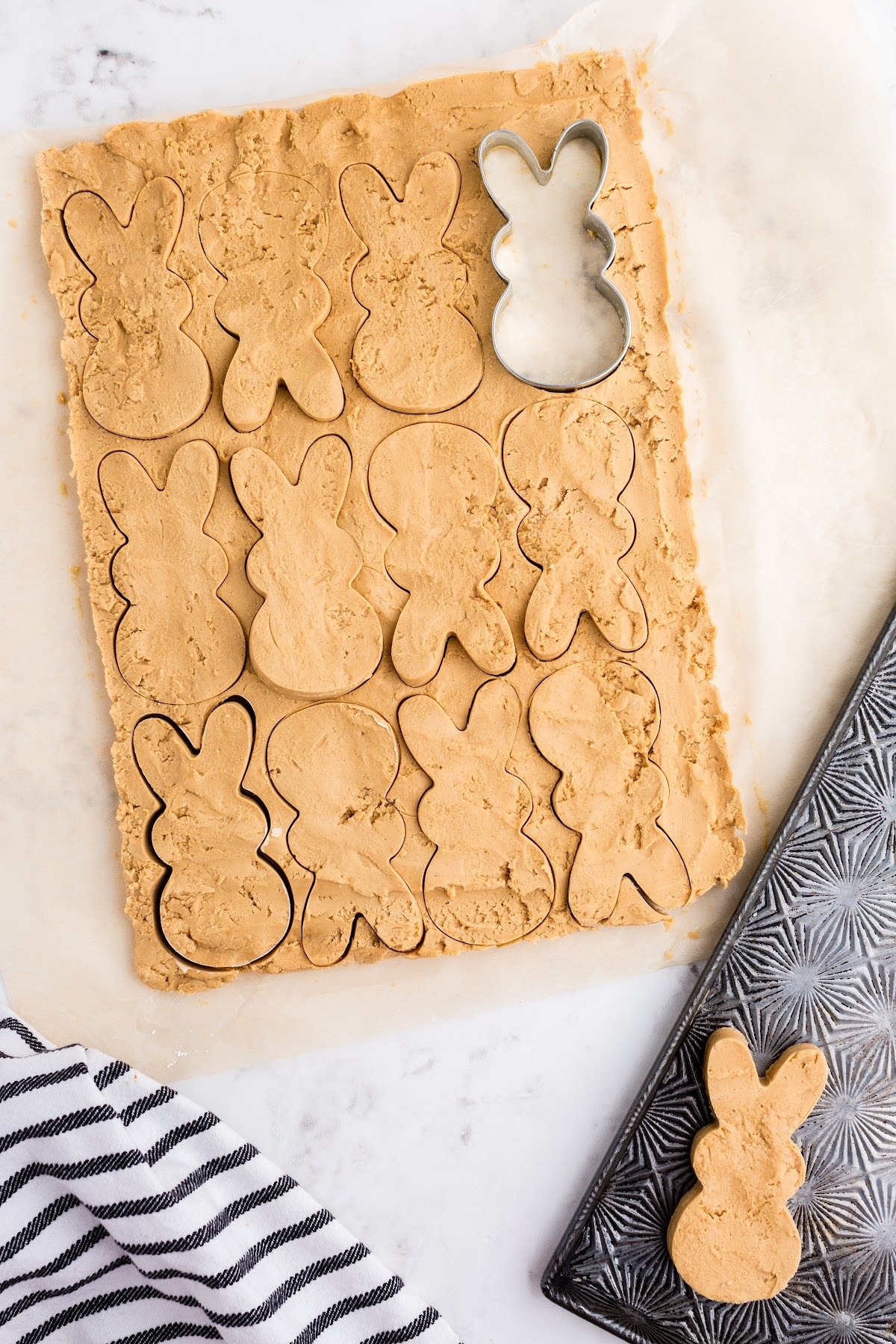 Lifted the chilled peanut butter filing out of the pan and onto the counter to begin cutting the shapes.