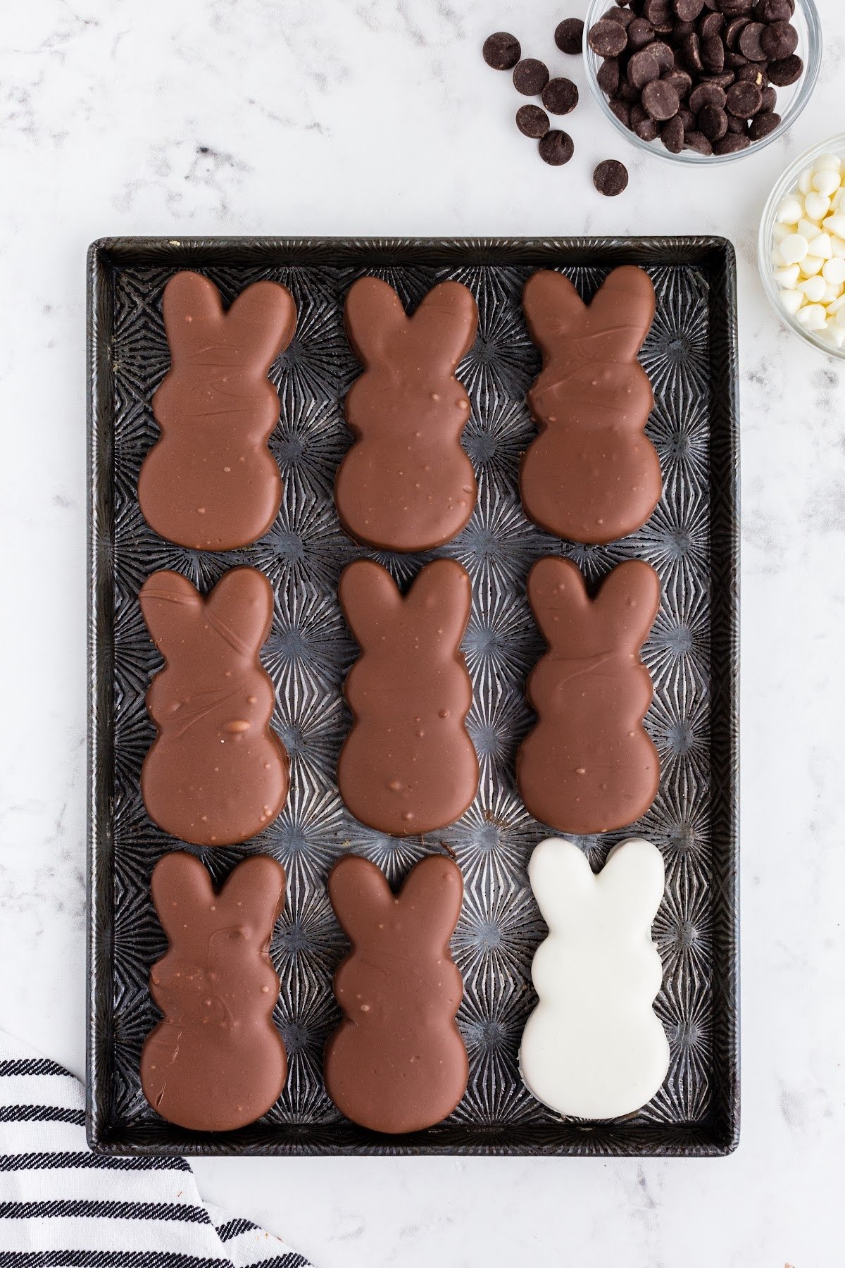 Cookie Sheet filled with white and dark chocolate covered bunnies.
