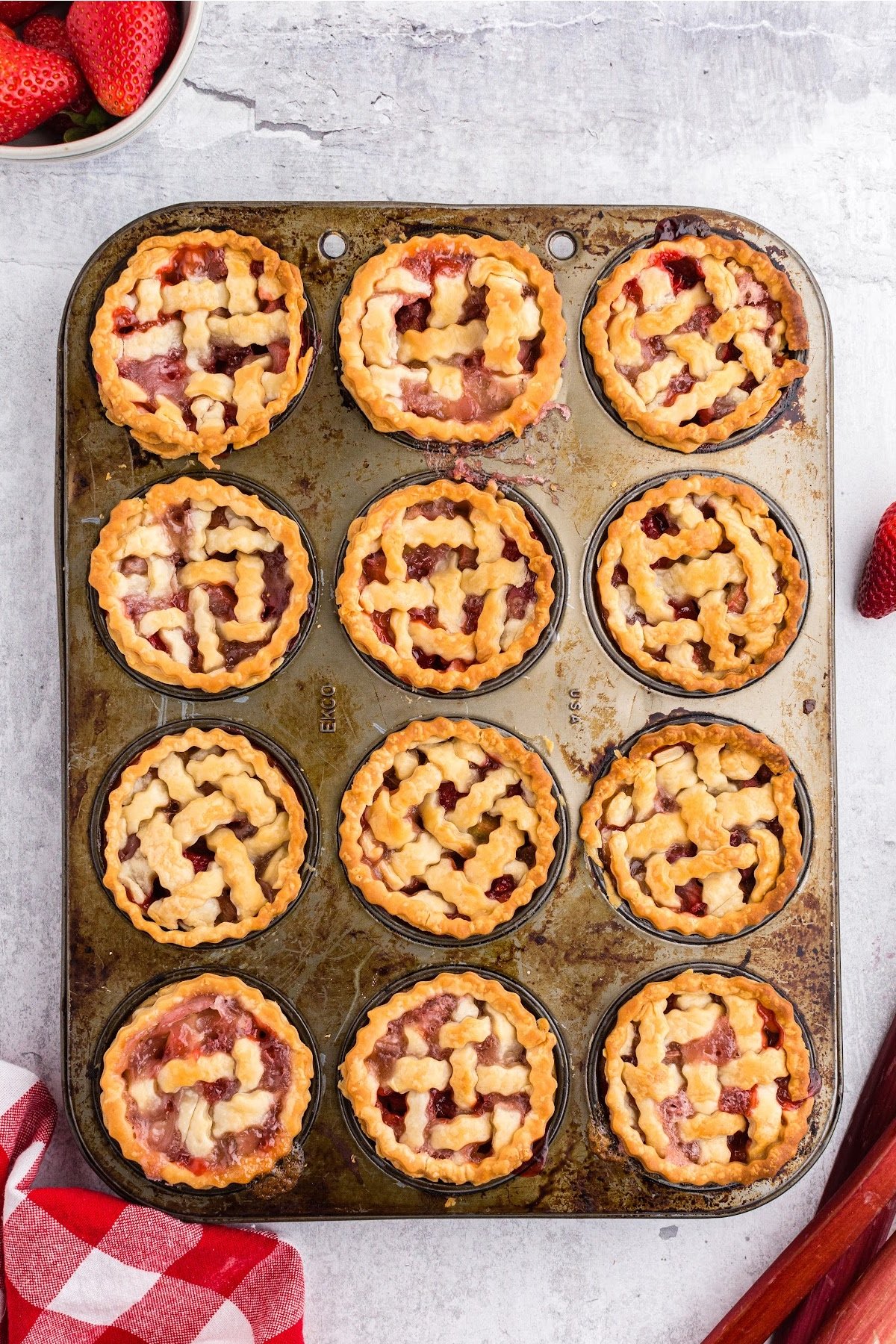 Fully baked mini pies in the muffin tin, ready to eat.