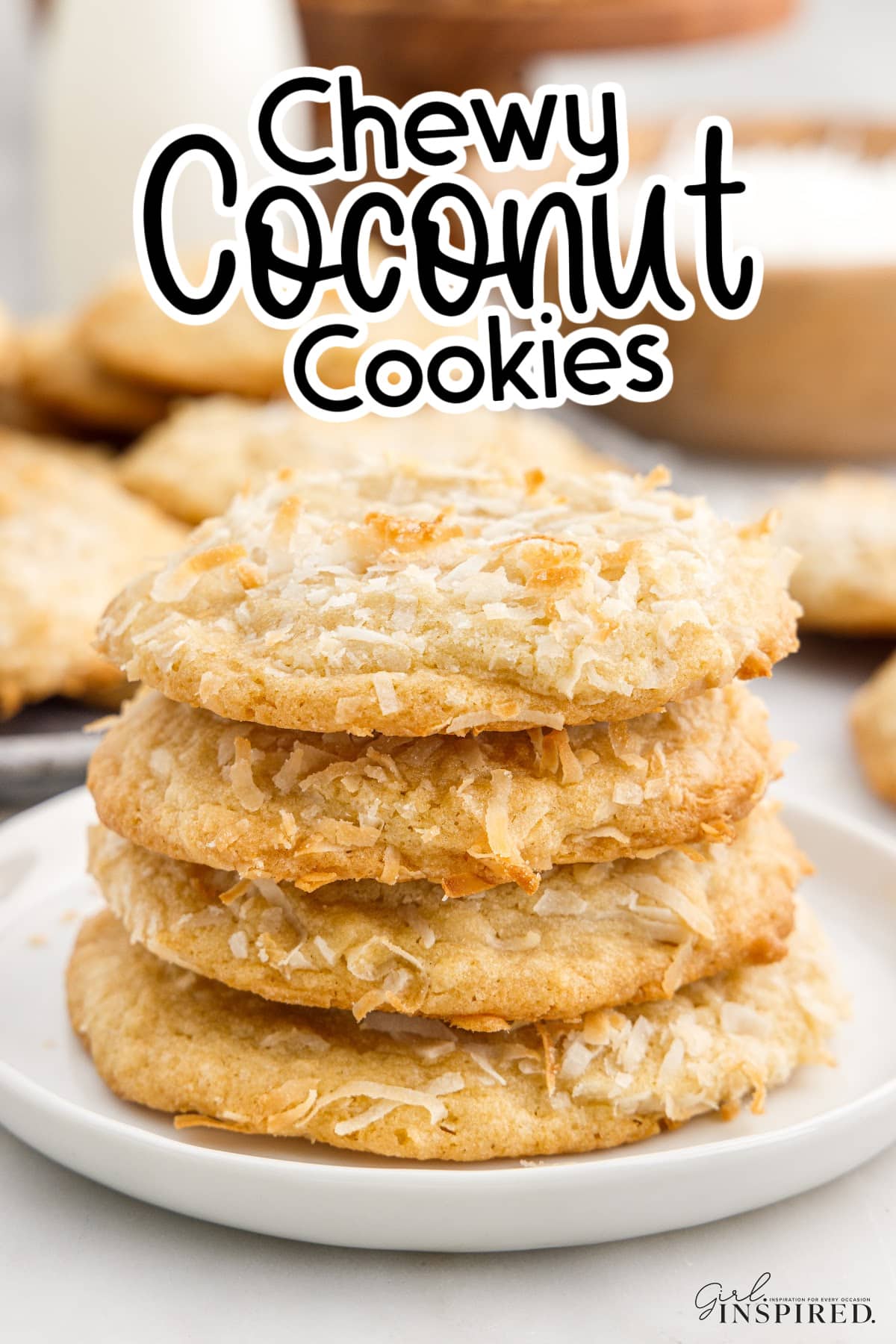 Stack of Chewy Coconut Cookies showing the flakes on the outside of the cookie, with text overlays.