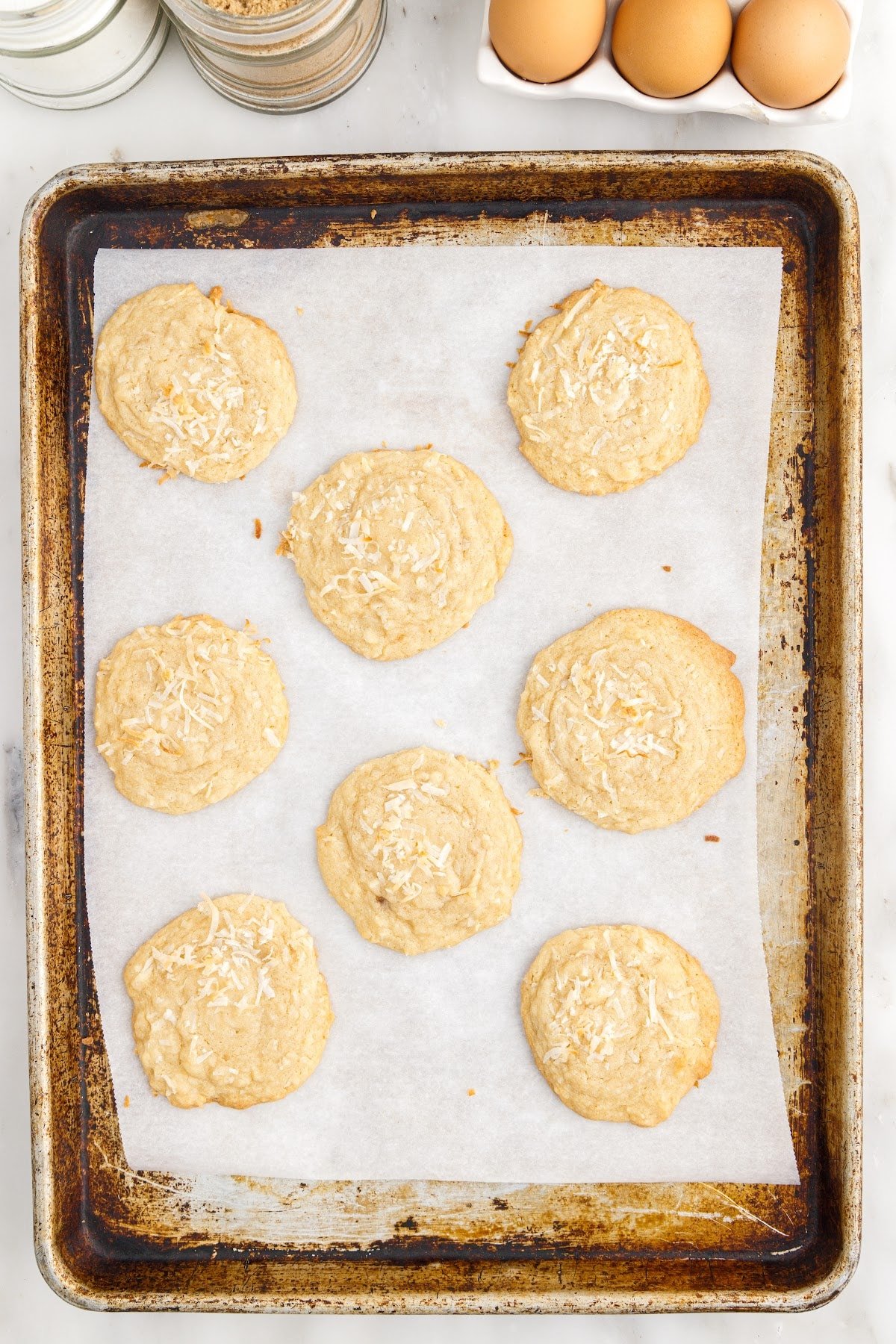 Fully baked cookies on the baking sheet.