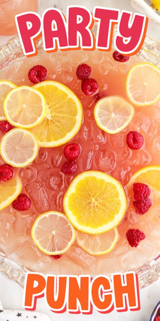 Top view of Party Punch Recipe showing the sliced lemons and berries inside the punch with other ingredients in the background.