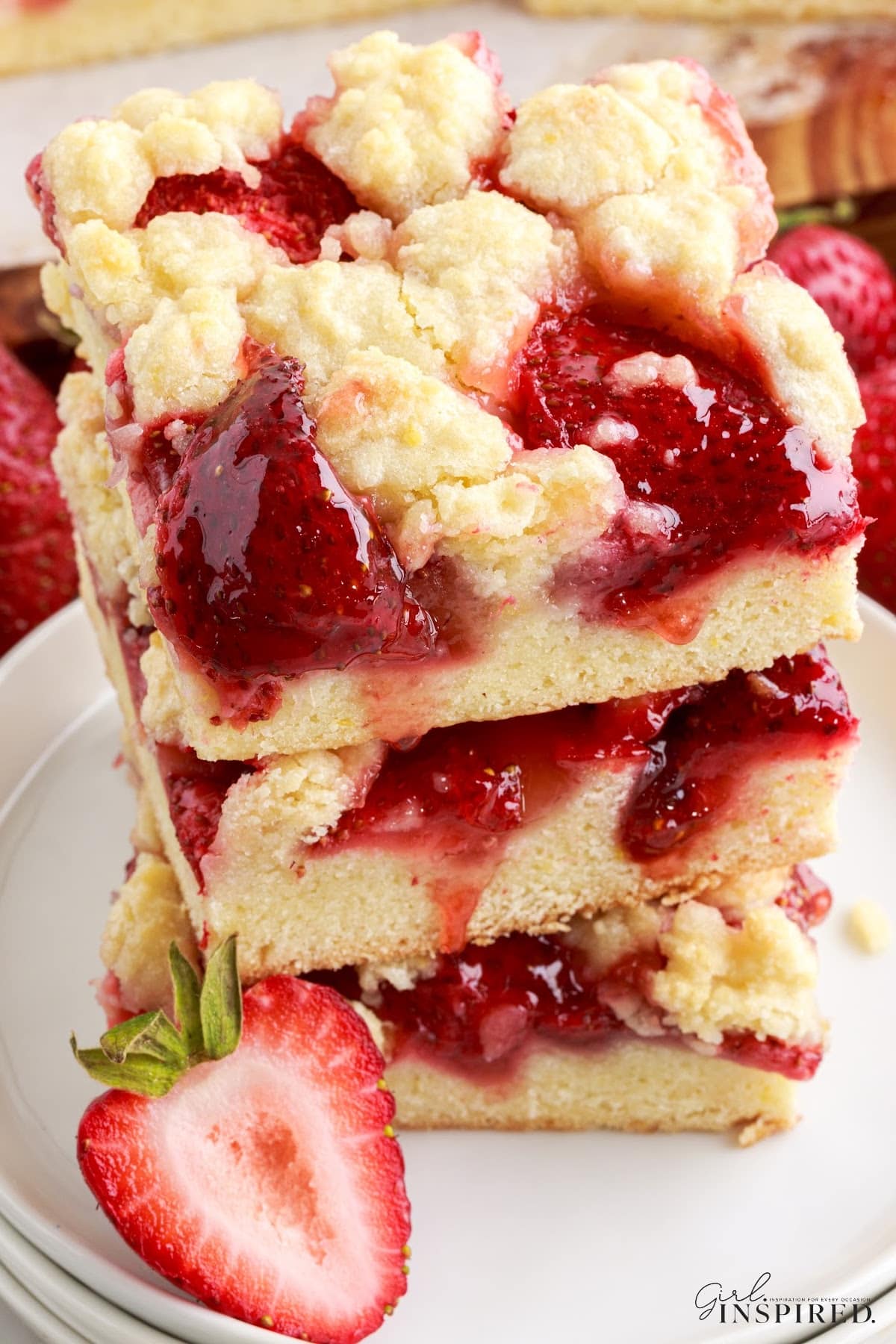 Top view of a stack of Strawberry Bars, showing the gooey strawberry mixture!