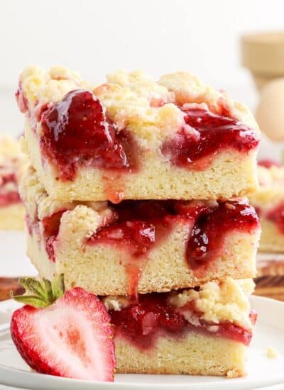 Side view of a stack of Strawberry Bars, showing the gooey strawberry mixture!