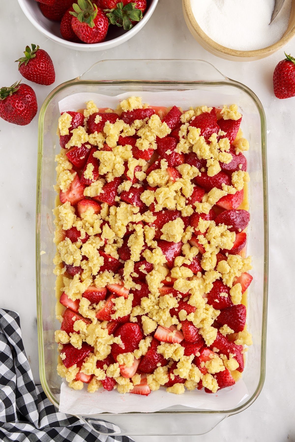 Crumbled the remaining dough over the strawberries in the baking dish.