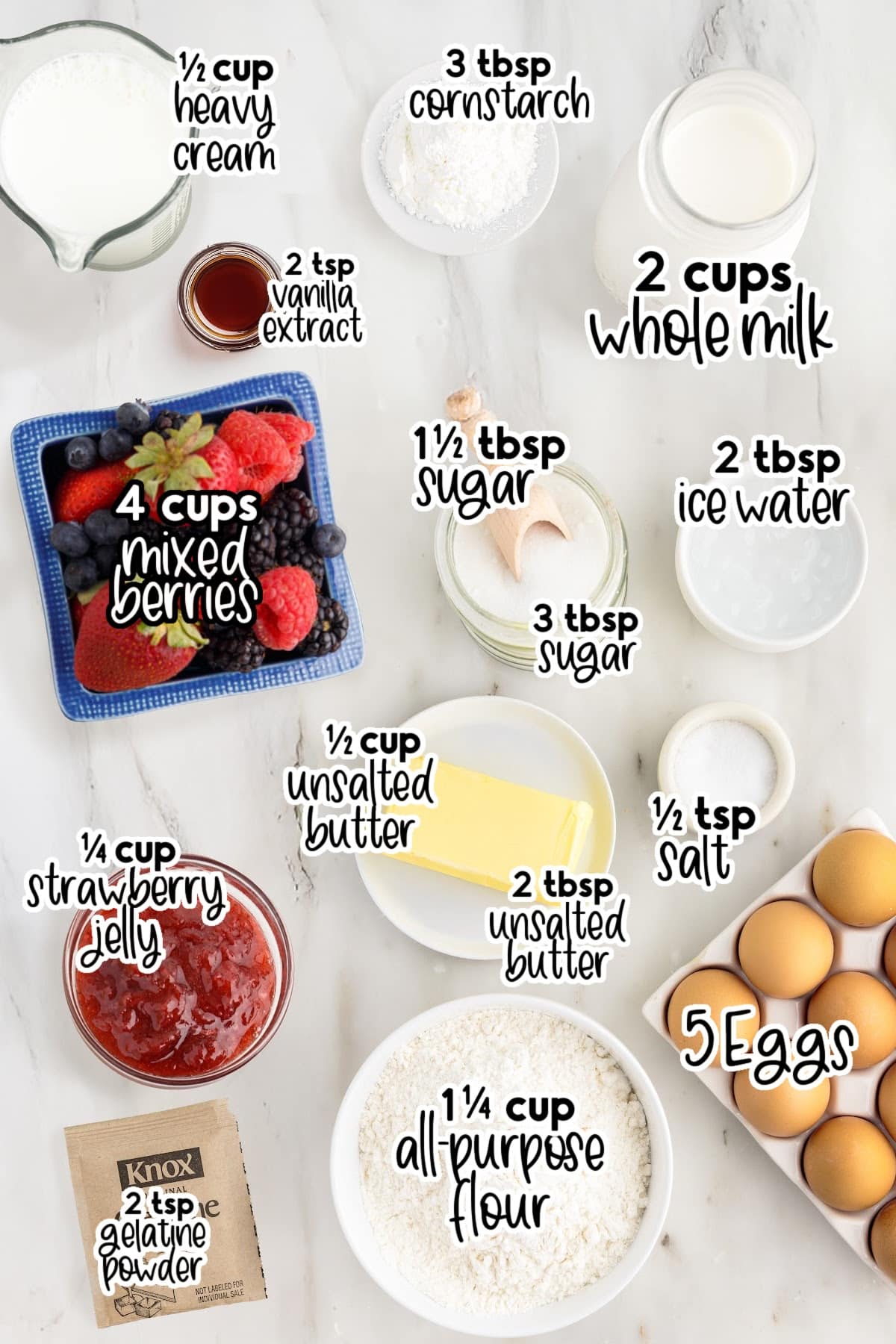 Ingredients to make Mixed Berry Tart on a marble countertop.