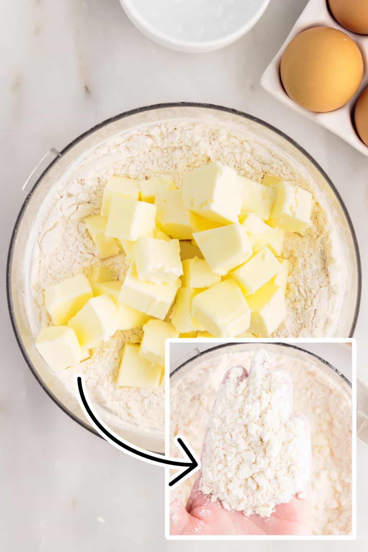 Cold butter pieces added to the bowl of dry ingredients.