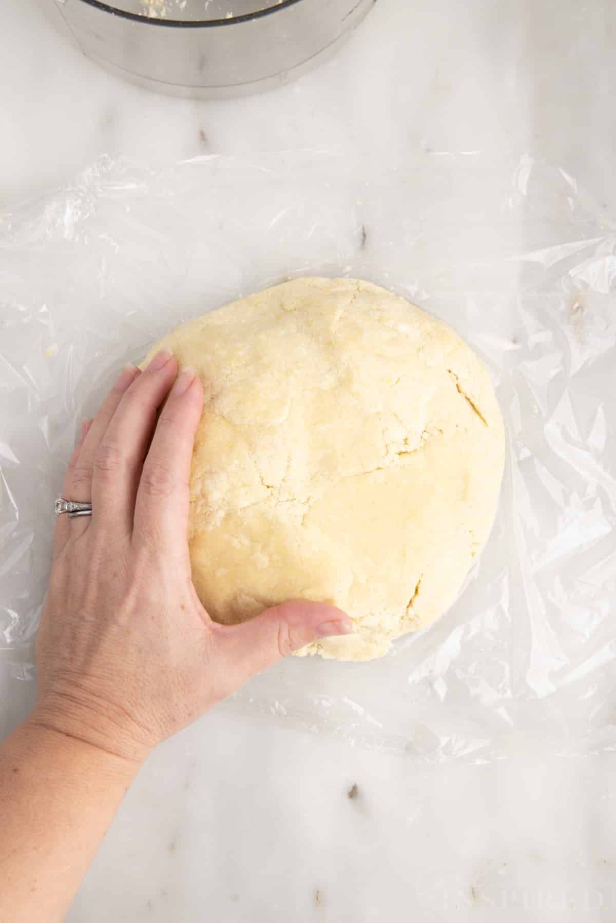 Pate sucree dough pressed into a mound.