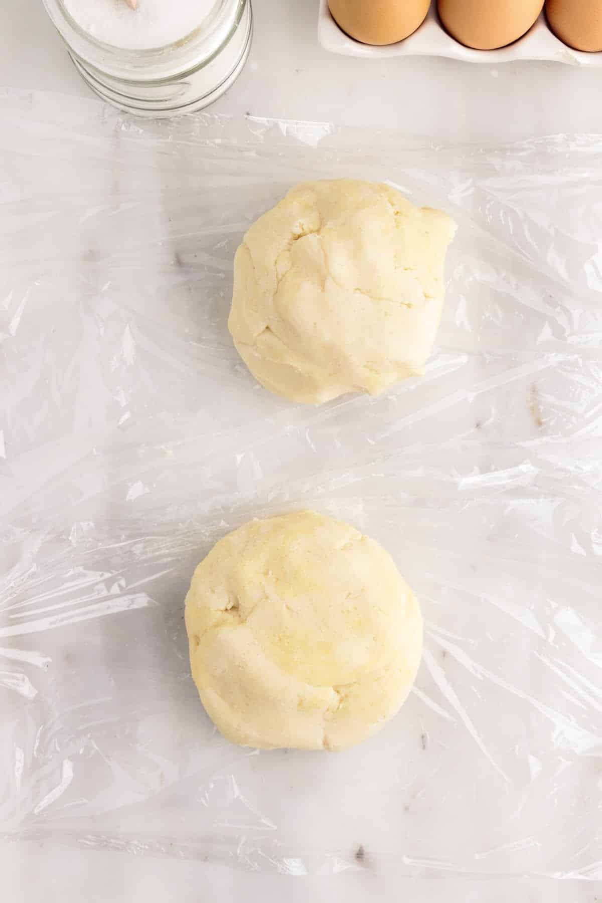 Pate sucree dough divided into two sections.
