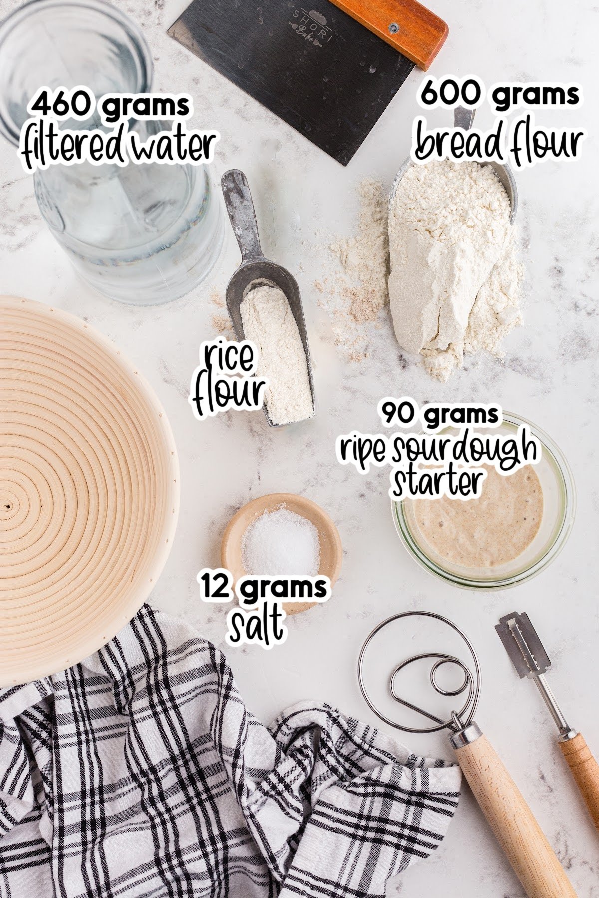 Individual ingredients and tools for making sourdough bread.