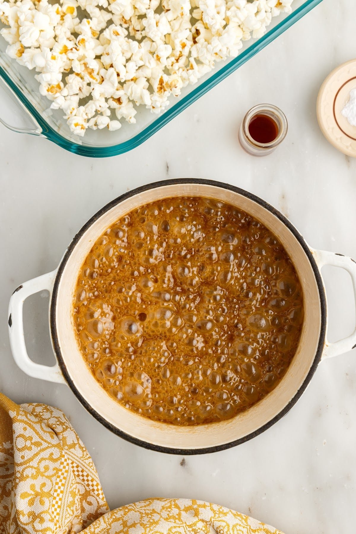 Boiling caramel sauce in saucepan.