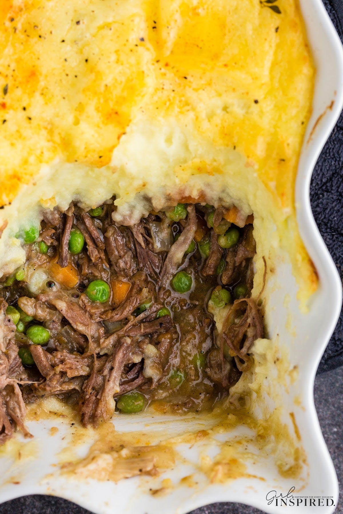Overhead shot of the baked Shepherd's pie with leftover roast beef, single serving removed.