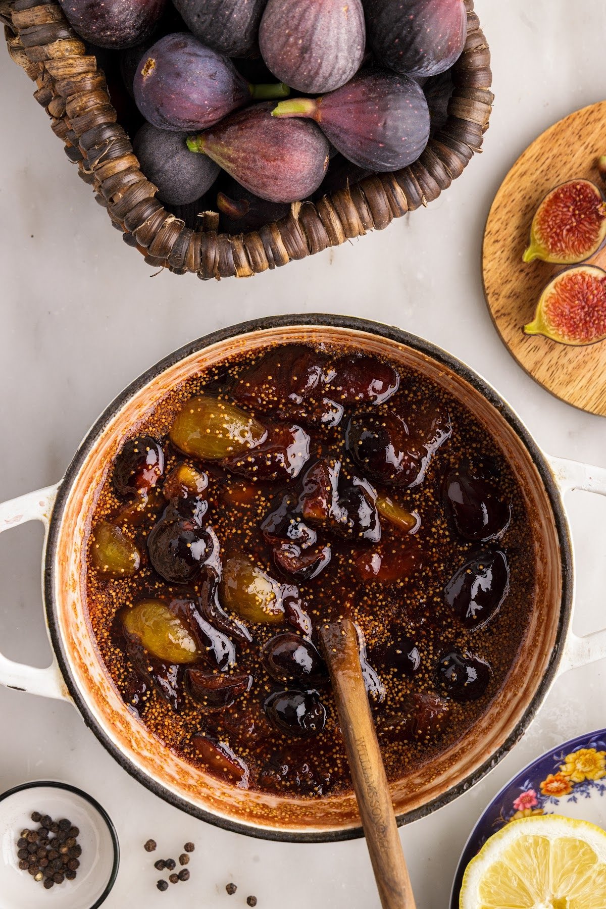 Balsamic fig jam mixture cooking and reducing in a saucepan.