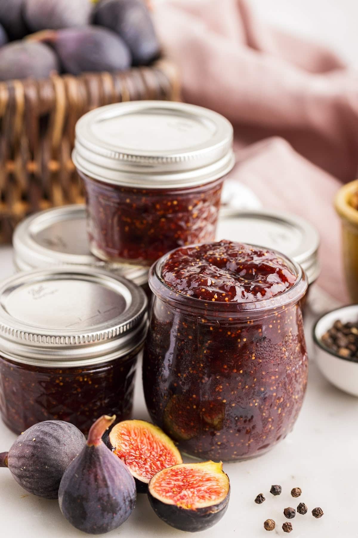 Balsamic fig jam transferred to prepared glass jars, ready to be stored and enjoyed.