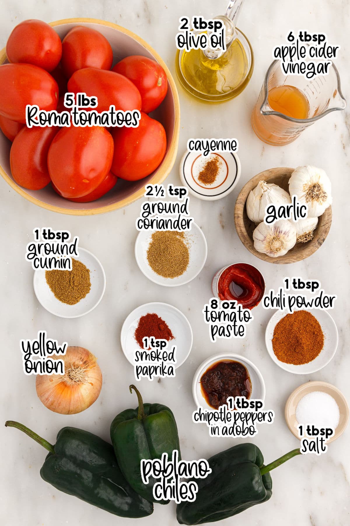 Red enchilada sauce ingredients on a marble countertop.